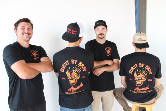 a group of men wearing black shirts