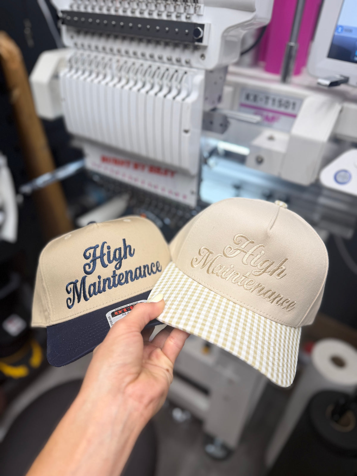 a pair of hats in front of a machine