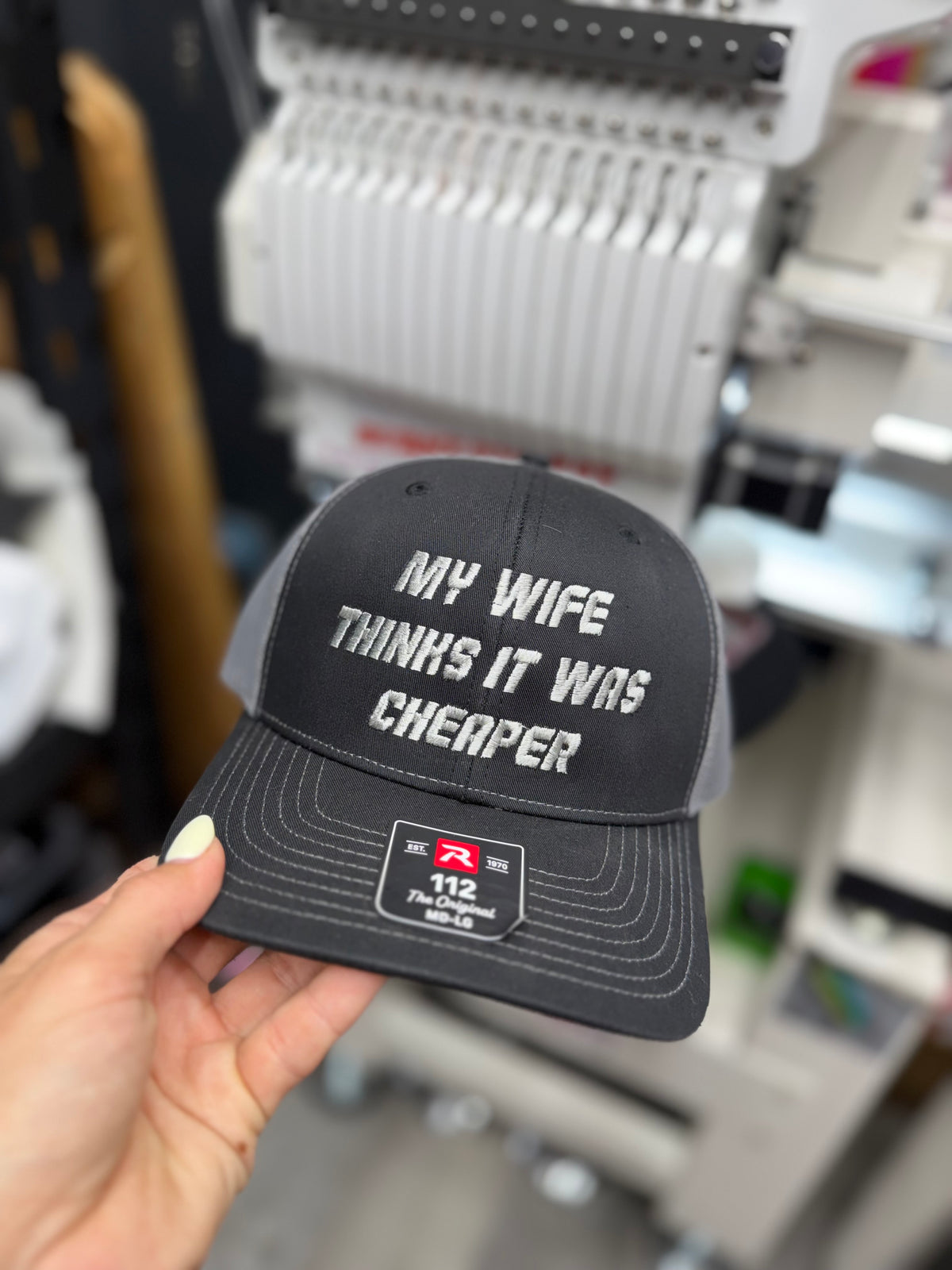 a hand holding a hat