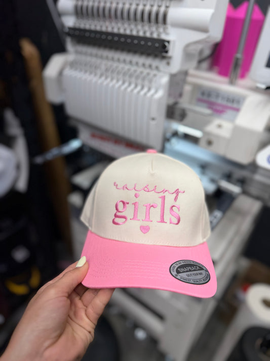 a hand holding a hat