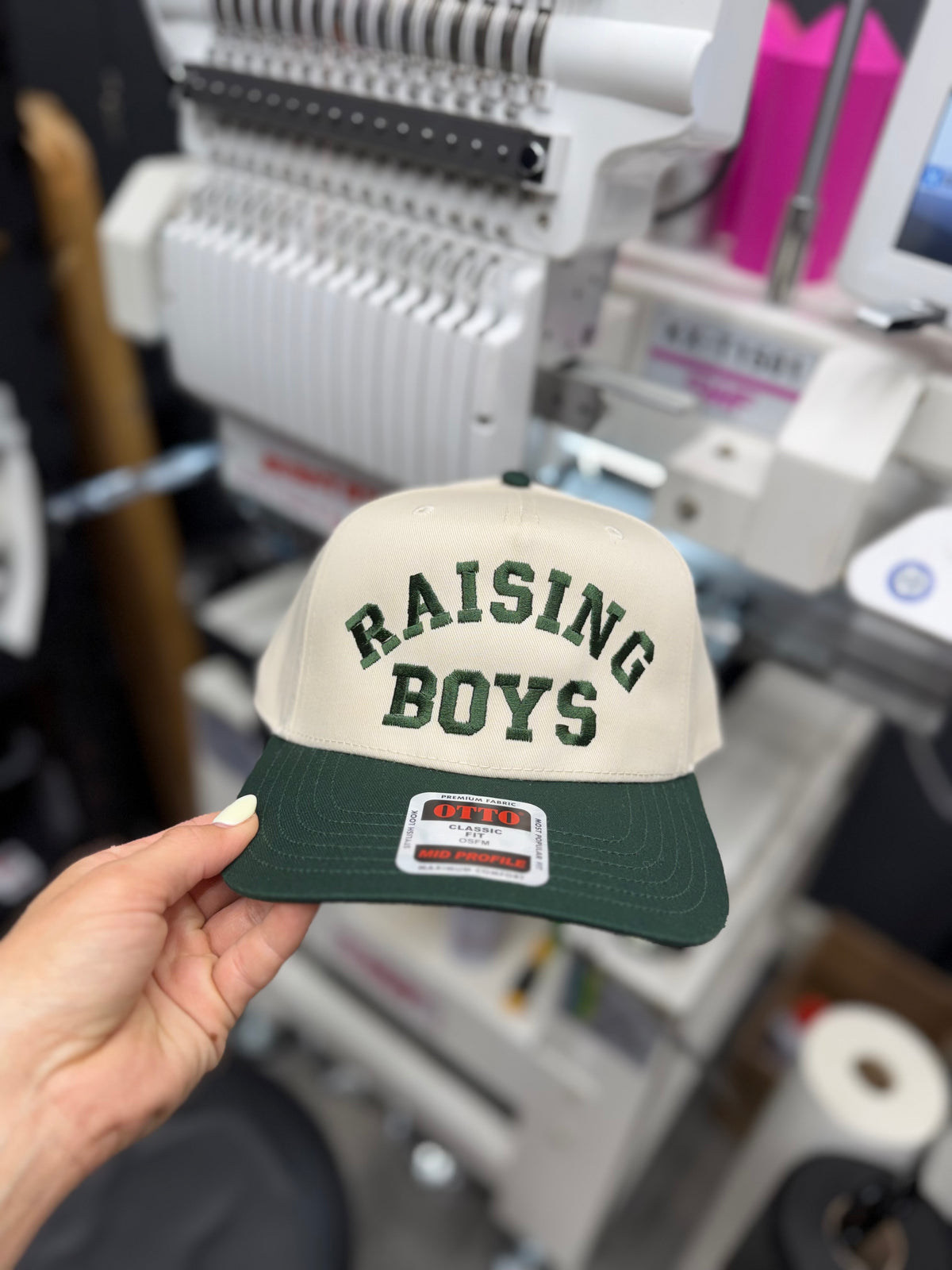 a hand holding a hat