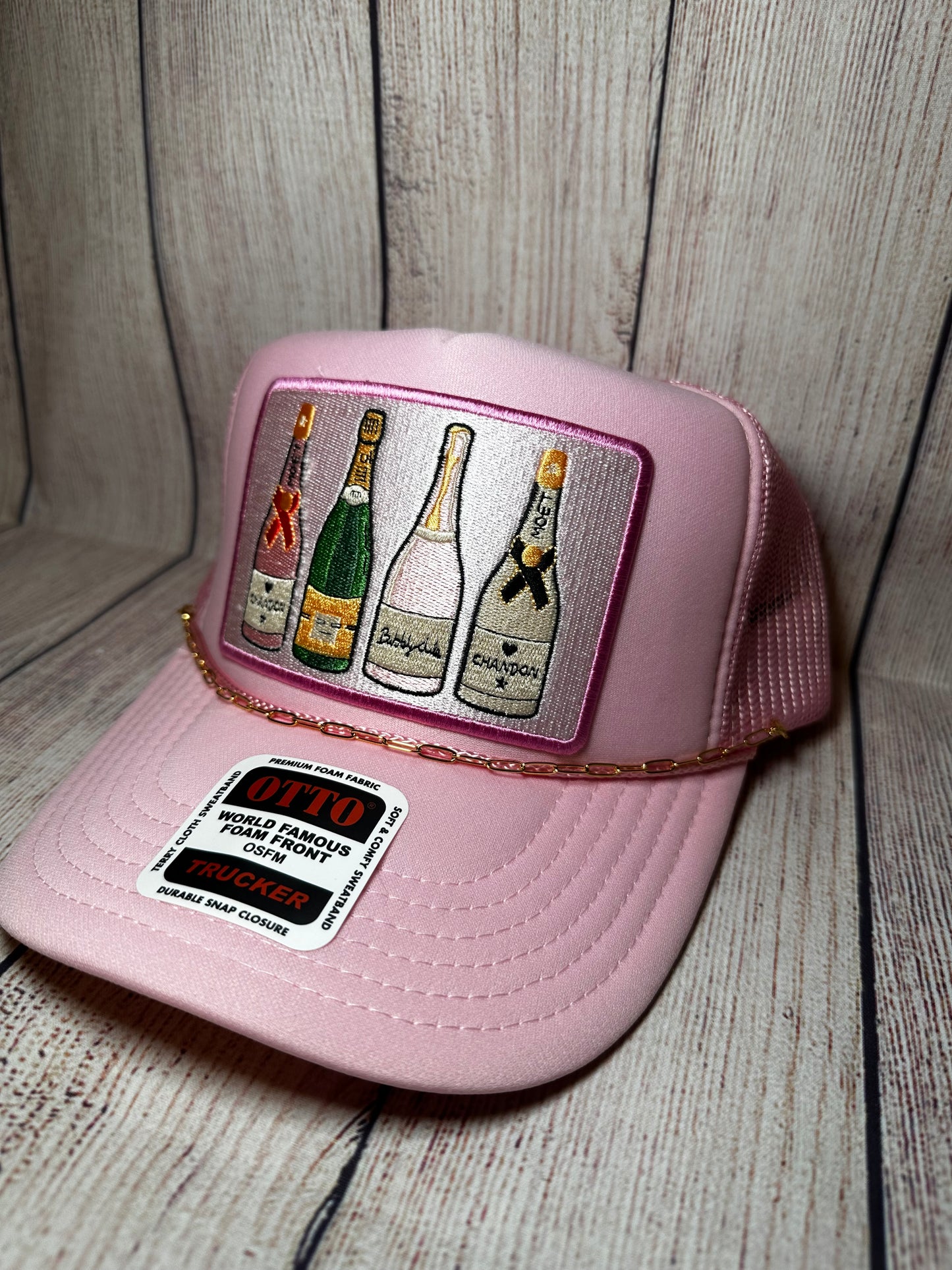 Pink champagne trucker hat