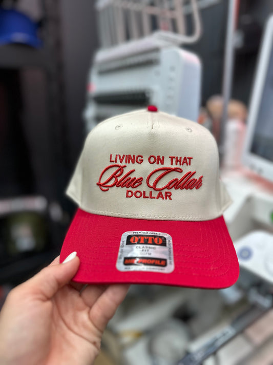 Living on that Blue Collar dollar embroidered trucker hat